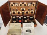 a wooden box with a bunch of old records in it