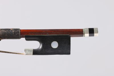a bow that is attached to a piece of wood