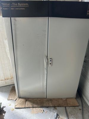 a refrigerator that is sitting in the corner of a room