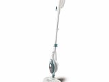 a close up of a steam mop on a white surface