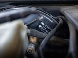 a close up of a car ' s engine with its hood open