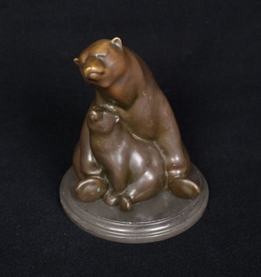 bronze sculpture of a bear and cub sitting on a base