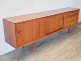 a wooden sideboard with two drawers and a drawer underneath it