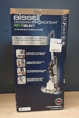 La boîte de l'aspirateur Bissell Crosswave Pet & Select est ouverte.