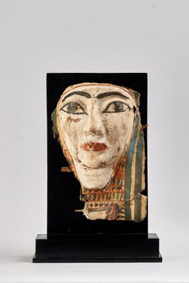 sculpture of a woman ' s face on a black base
