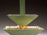 a green object that is sitting in the middle of a table