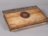 a small wooden box that has a picture on it