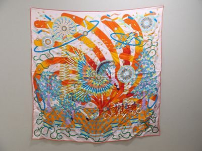 a colorful scarf hanging on a wall in a room
