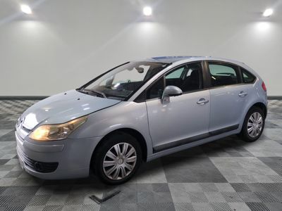 a picture of a silver car parked in a garage