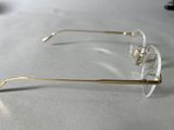 glasses on a table with a white table cloth and a pair of glasses on top of it