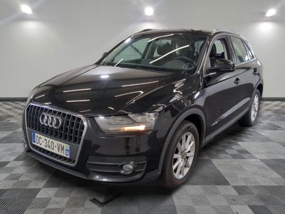 the audi qx is parked on a checkered tile floor
