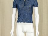 a male mannequin wearing a blue shirt and white pants