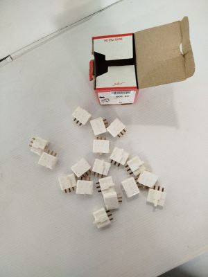 a box of small pieces of electrical equipment on a table