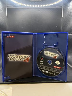 the box is open with a game on it and a dvd in it