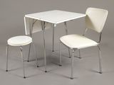 two chairs and a table with a small table underneath it