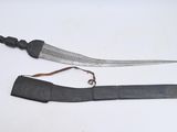 a knife that is laying on the table next to a knife