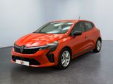 une voiture rouge garée dans une pièce au sol noir