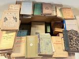 a lot of books that are stacked on top of each other