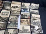 several old black and white photographs of a town and a church