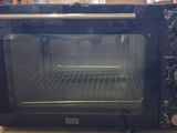 a black toaster oven sitting on the floor