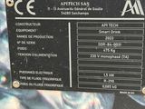 a sign on the side of a machine that says aptech saas