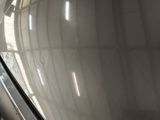 an escalator that is in a building with a large window