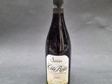 a bottle of wine sitting on top of a table