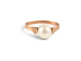 a close up of a pearl ring on a white background