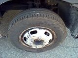 a flat tire on the flatbed of a truck
