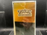 a close up of a box of pokemon trading cards on a table