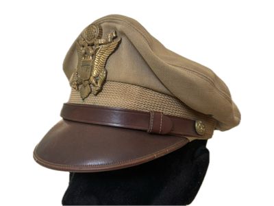 brown hat on a mannequin head with a leather belt