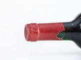a bottle of wine that has been left on the table