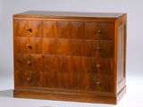 a wooden chest of drawers on a white background