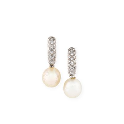 a pair of pearl and diamond earrings