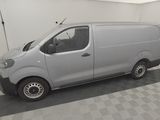 a picture of a silver van parked in a garage