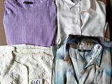 three men ' s shirts in a box with a price tag on them