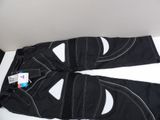 a pair of ski pants that are laying on the floor