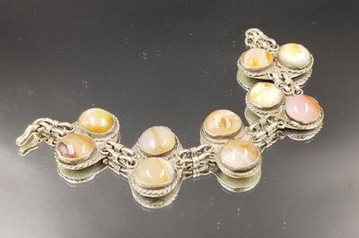 a picture of a bracelet that has a bunch of stones on it