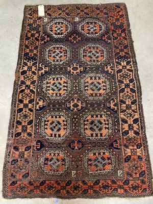 an antique persian rug with geometric design