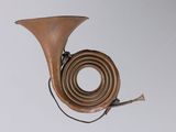 a brass instrument that is hanging from the ceiling