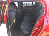 a red car with black seats in the back of it