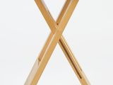an image of a small wooden table with two crossed legs