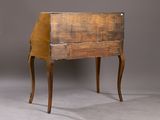 a small wooden table with a drawer on it