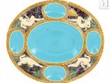 a blue plate with a picture of a woman and two dogs on it