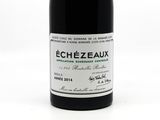 a bottle of wine that is sitting on a table