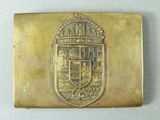 an image of a gold plate with a coat of arms on it