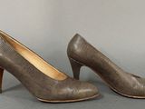 an image of a pair of women ' s shoes on a gray surface