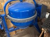 a blue machine that is sitting in a room