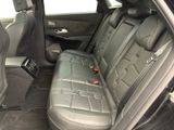 the back seat of a car with a remote control in it