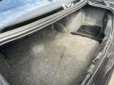 the trunk of a car with the seat folded down